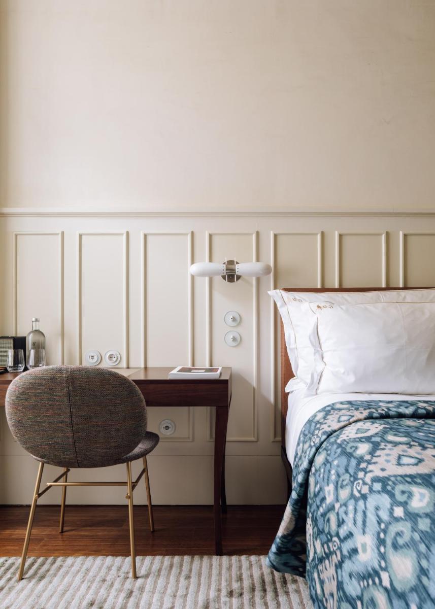 Uma cama ou camas num quarto em Bairro Alto Hotel