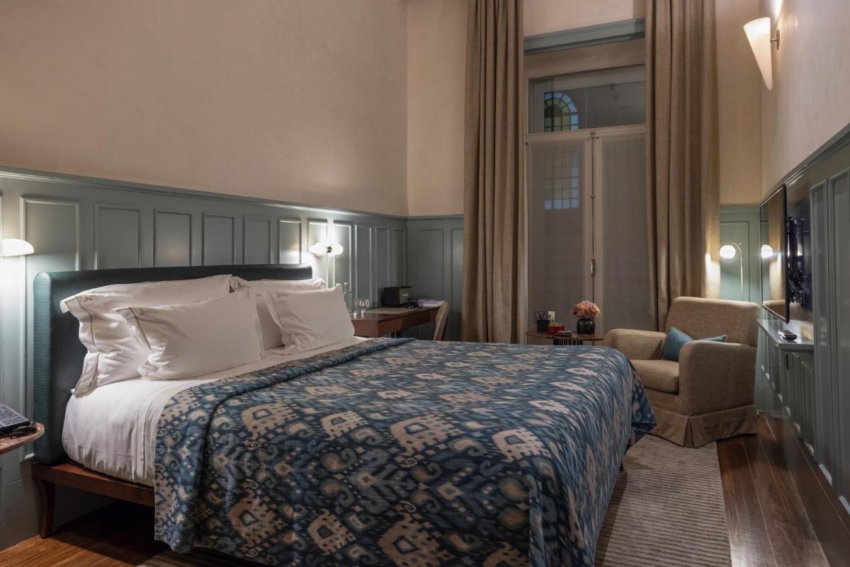 Uma cama ou camas num quarto em Bairro Alto Hotel