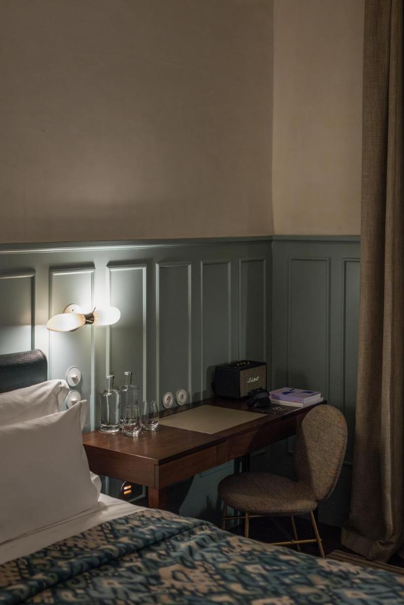 Uma cama ou camas num quarto em Bairro Alto Hotel