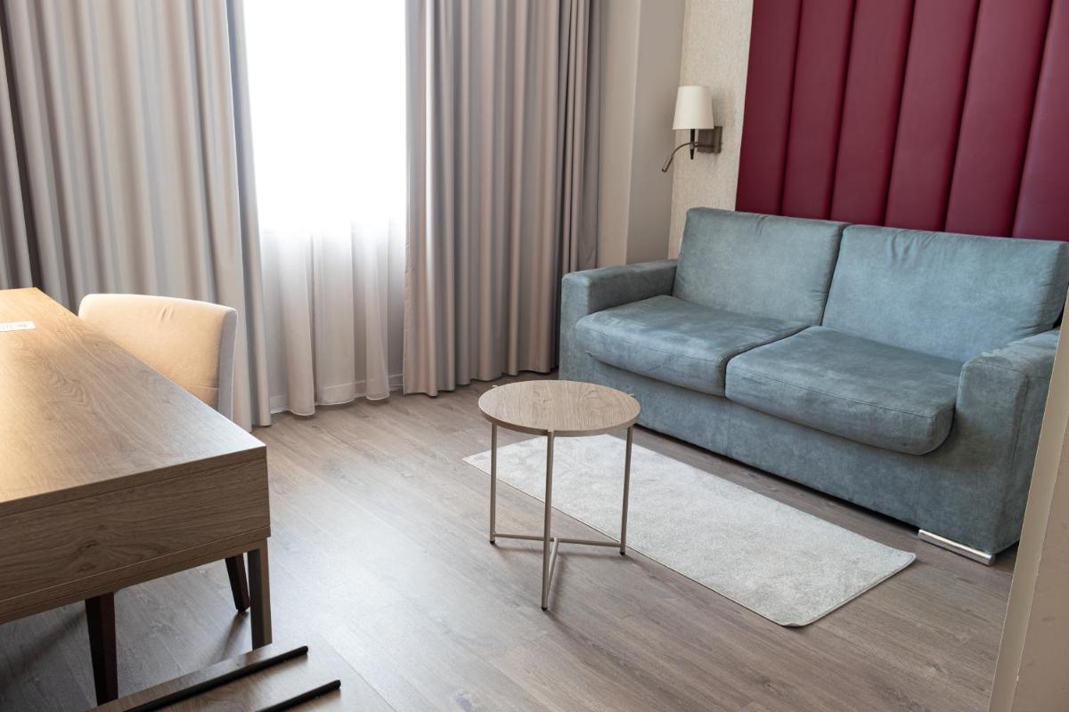 Uma área de estar em MASA Hotel & Spa Campo Grande Collection