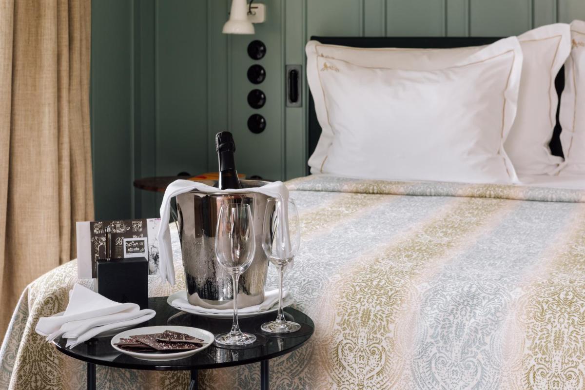 Uma cama ou camas num quarto em Bairro Alto Hotel