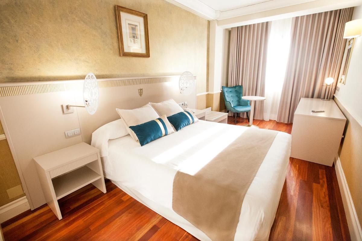 Cama o camas de una habitación en Hotel Alfonso VIII