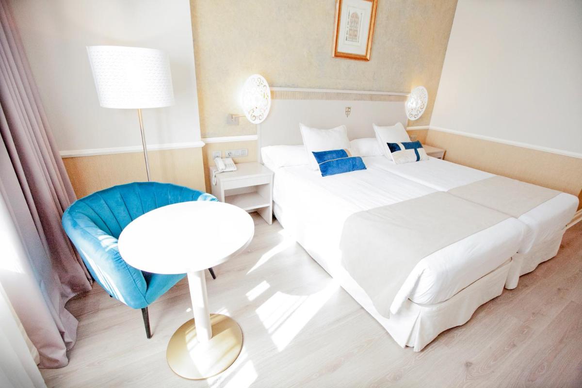 Cama o camas de una habitación en Hotel Alfonso VIII
