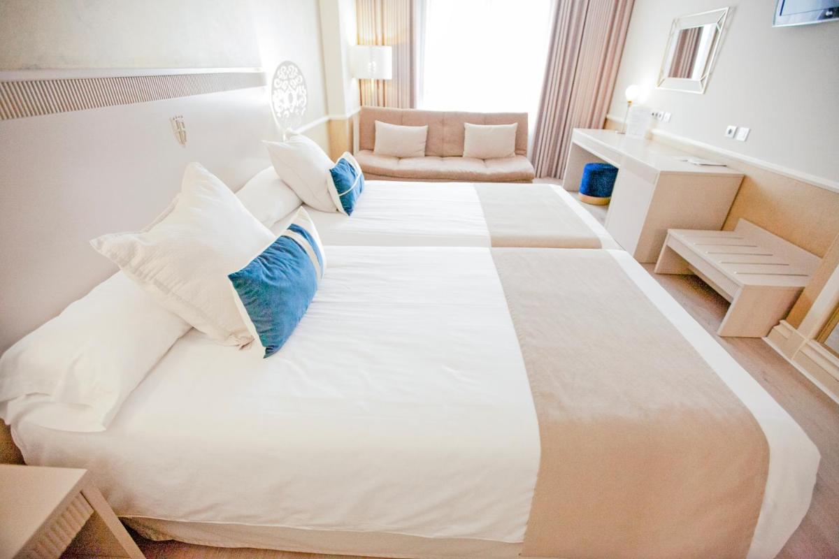 Cama o camas de una habitación en Hotel Alfonso VIII