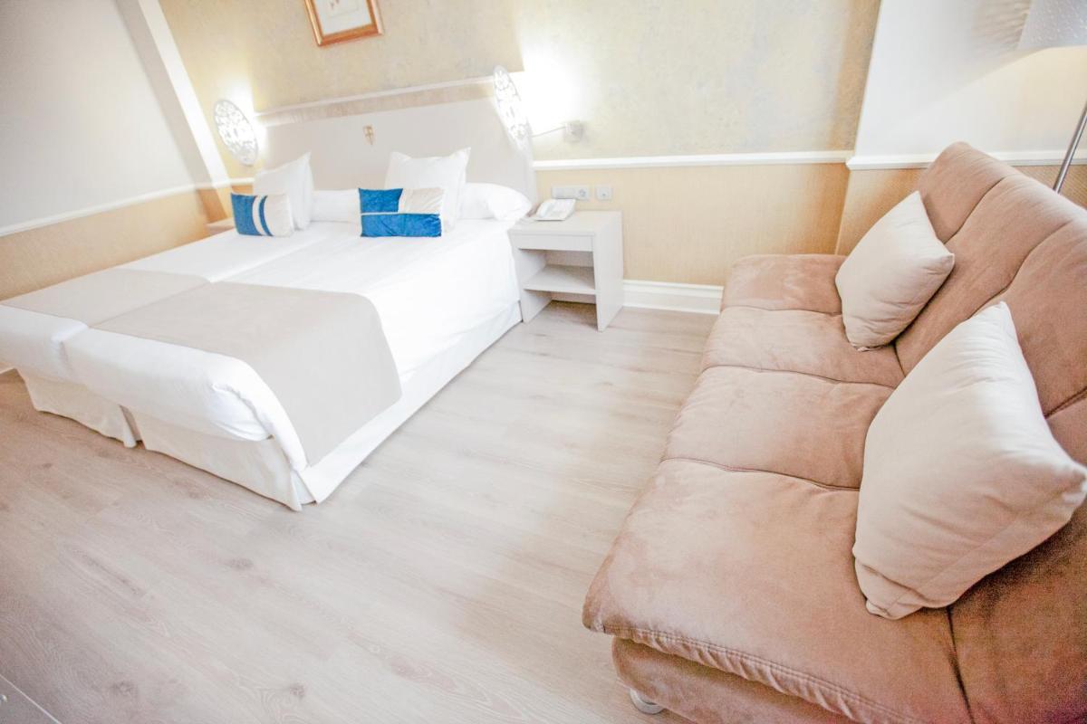 Cama o camas de una habitación en Hotel Alfonso VIII