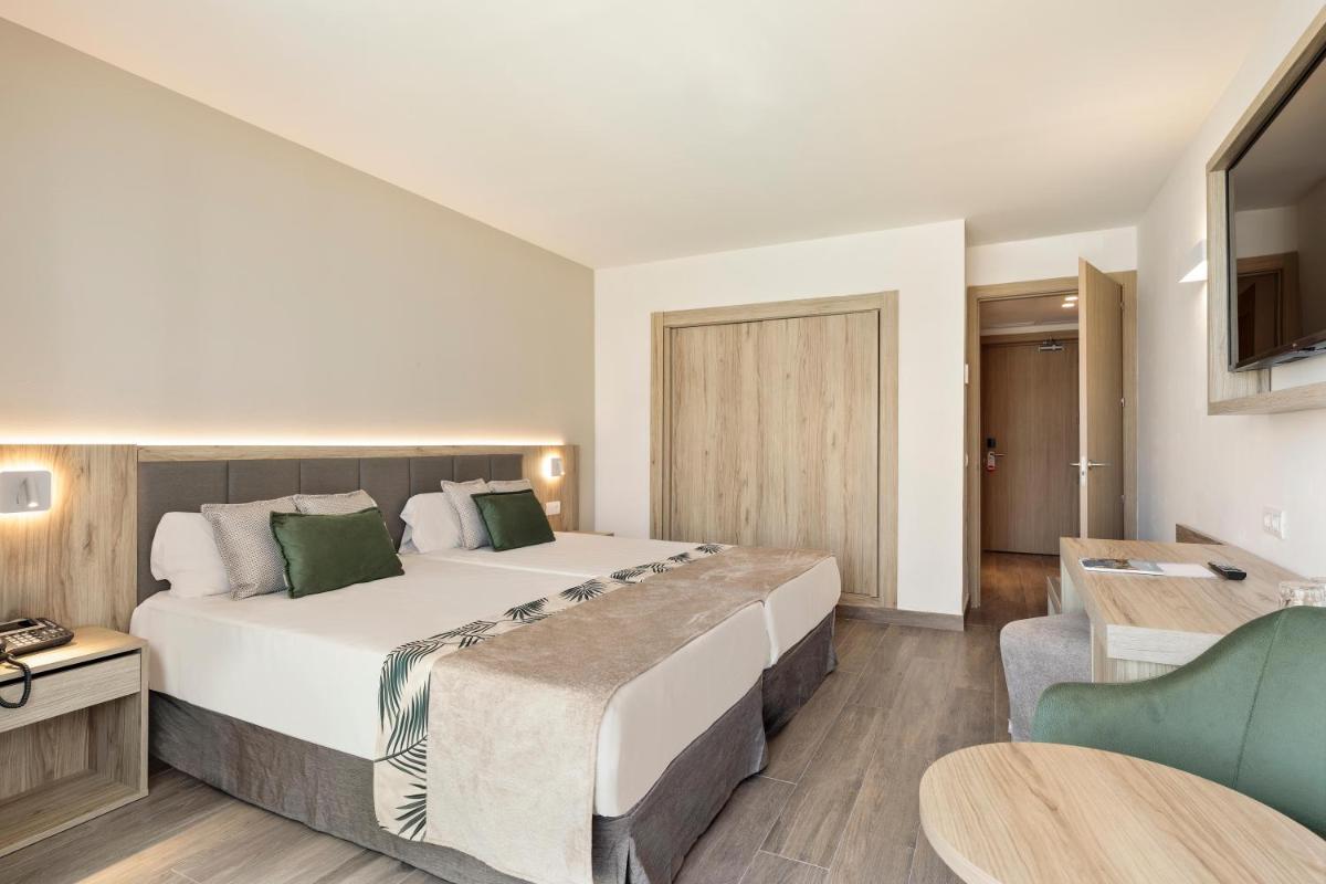 Cama o camas de una habitación en Hotel Best Triton