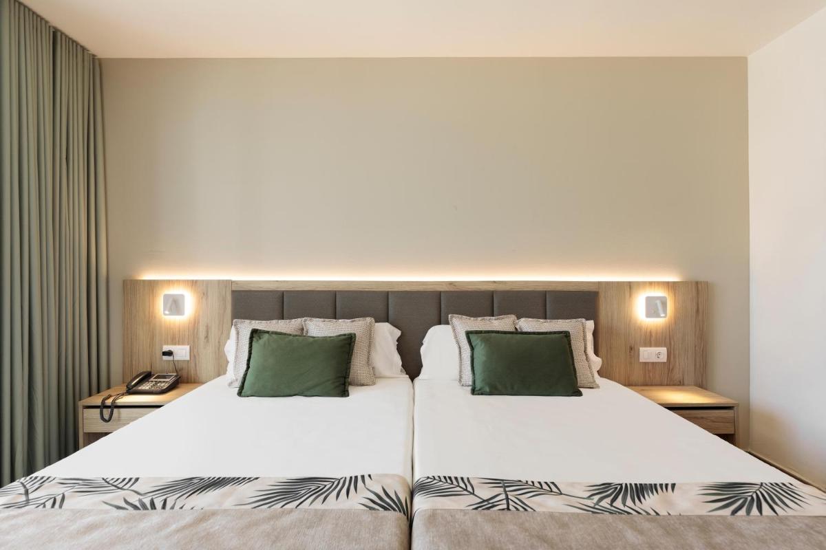 Cama o camas de una habitación en Hotel Best Triton