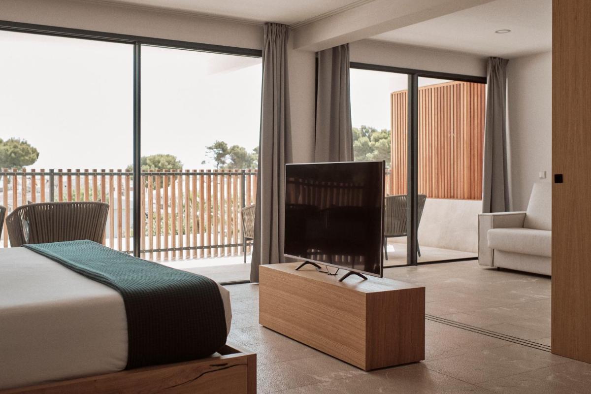 Cama o camas de una habitación en Las Gaviotas Suites Hotel & Spa
