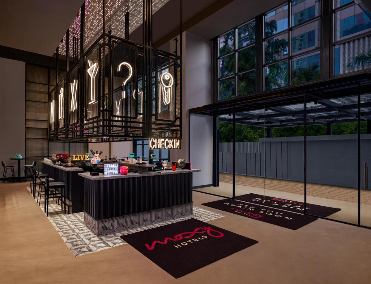 a rendering of a restaurant with a bar in a building at Moxy Mumbai Andheri West in Mumbai