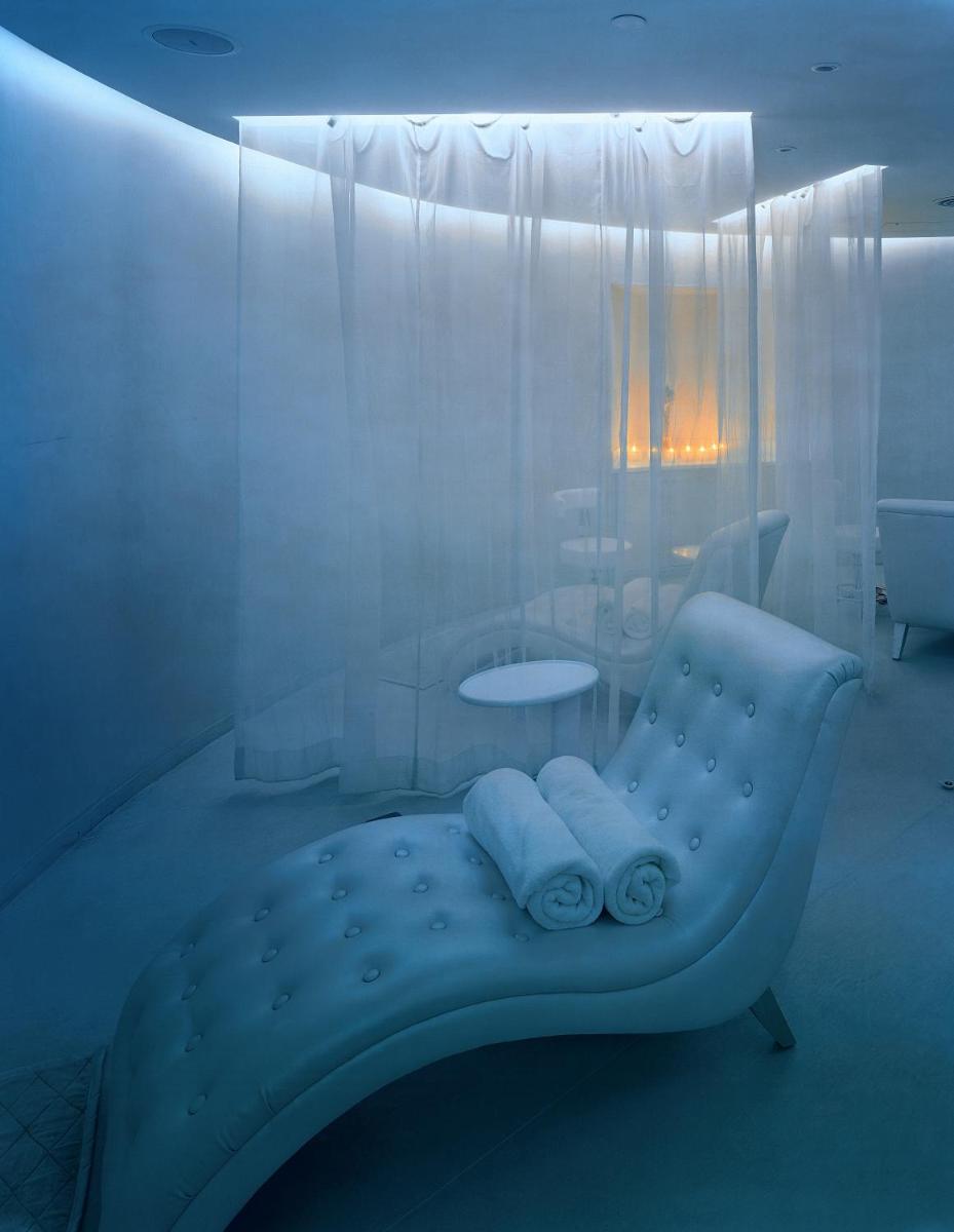 a white room with a chair and a table at The Park Hyderabad, Banjara Hills near Hussain Sagar Lake in Hyderabad a white room with a chair and a table at The Park Hyderabad, Banjara Hills near Hussain Sagar Lake in Hyderabad