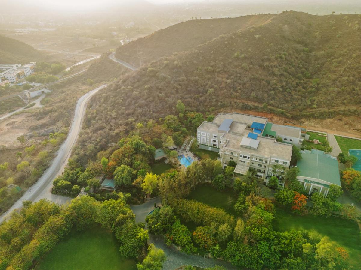 an aerial view of a house on a mountain at Essentia Luxury Resort & Spa Udaipur in Udaipur