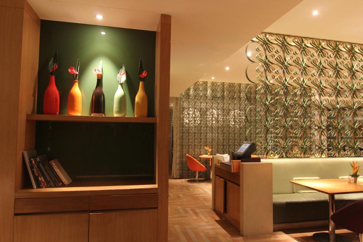 a lobby with vases on the wall in a store at The Park Hyderabad, Banjara Hills near Hussain Sagar Lake in Hyderabad a lobby with vases on the wall in a store at The Park Hyderabad, Banjara Hills near Hussain Sagar Lake in Hyderabad
