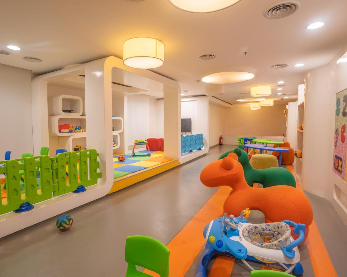 a childrens playroom with a room filled with toys at Hilton Bangalore Embassy GolfLinks in Bengaluru