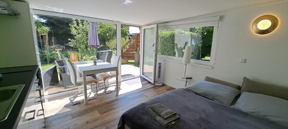 All-in-One Apartment mit eigener Sonnenterrasse im Garten - Housity