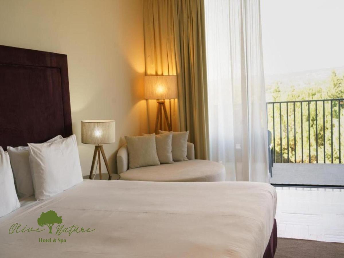 Uma cama ou camas num quarto em Olive Nature Hotel & SPA - Quinta Valle de Passos