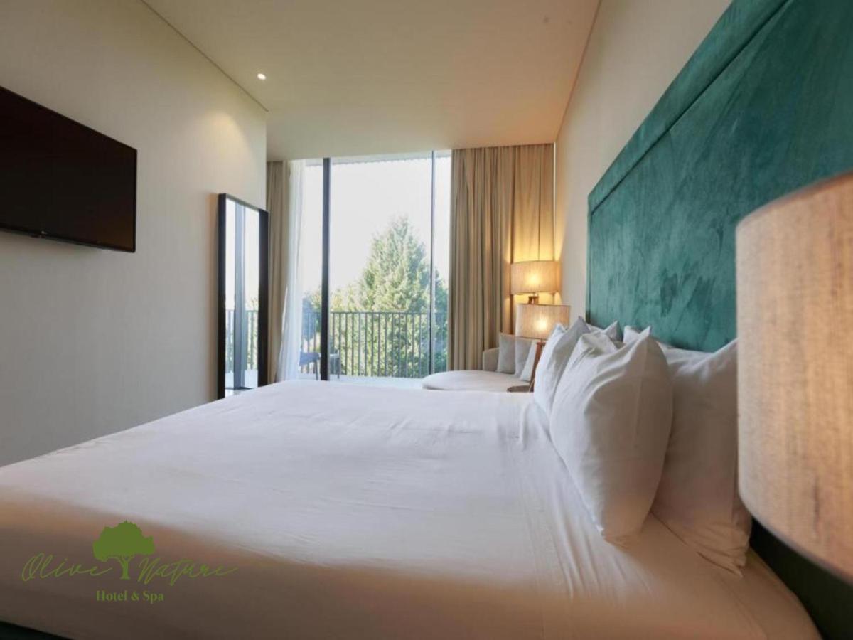 Uma cama ou camas num quarto em Olive Nature Hotel & SPA - Quinta Valle de Passos