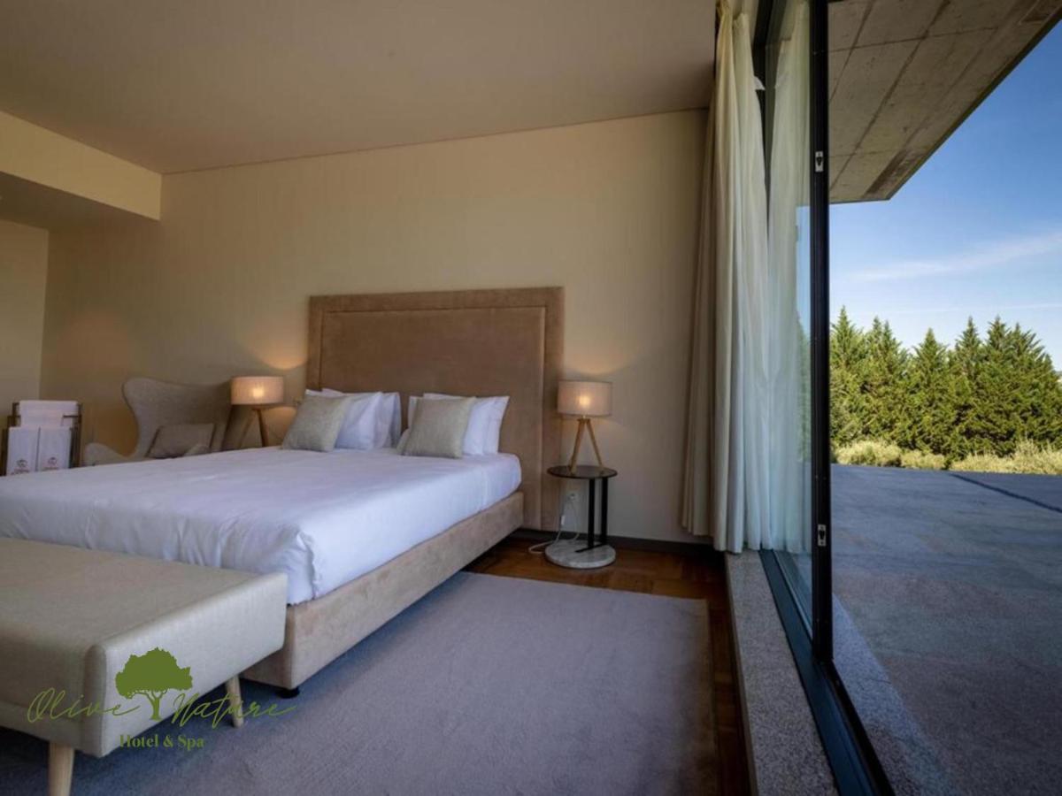 Uma cama ou camas num quarto em Olive Nature Hotel & SPA - Quinta Valle de Passos