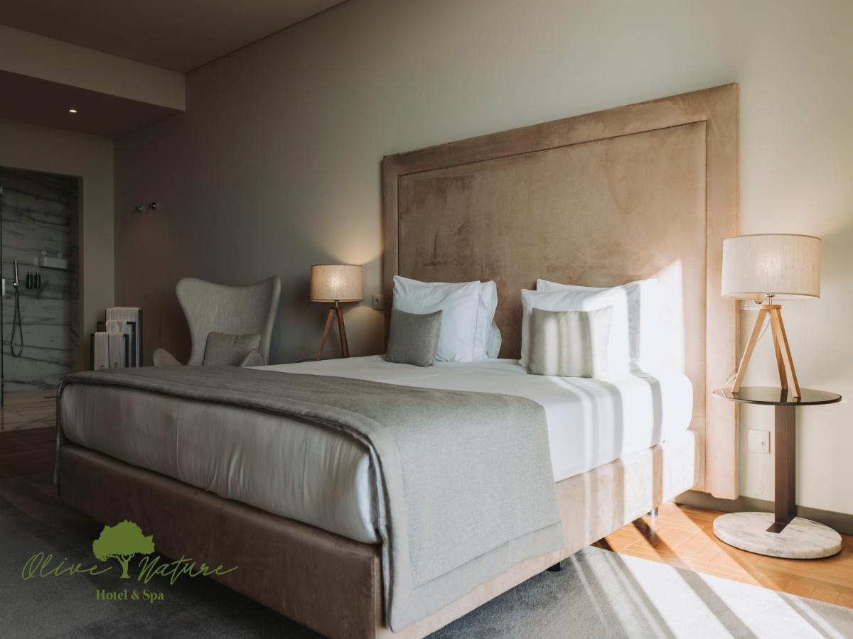 Uma cama ou camas num quarto em Olive Nature Hotel & SPA - Quinta Valle de Passos