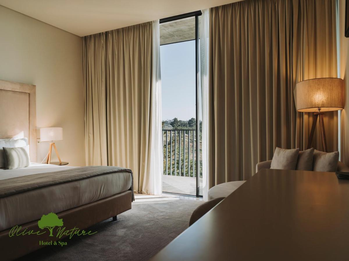 Uma cama ou camas num quarto em Olive Nature Hotel & SPA - Quinta Valle de Passos