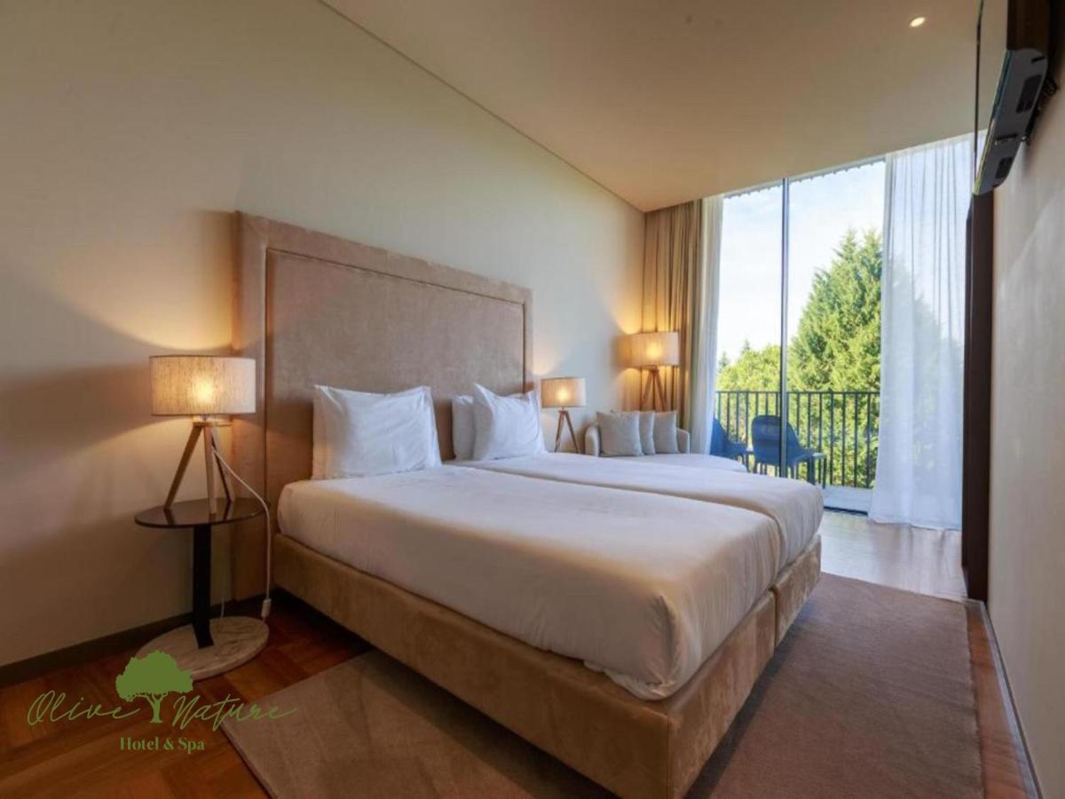 Uma cama ou camas num quarto em Olive Nature Hotel & SPA - Quinta Valle de Passos