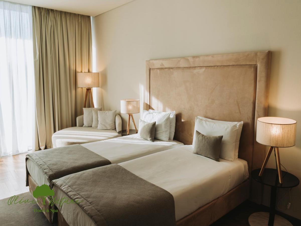 Uma cama ou camas num quarto em Olive Nature Hotel & SPA - Quinta Valle de Passos