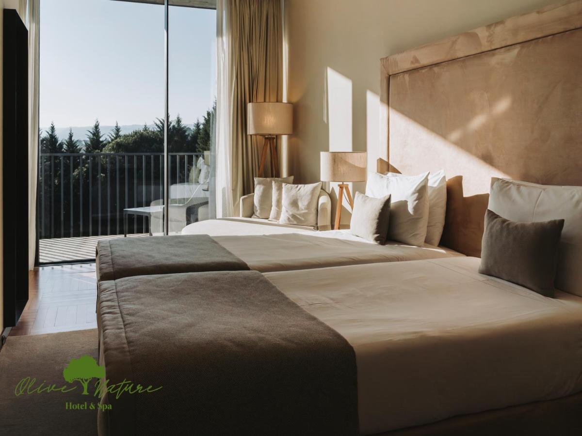 Uma cama ou camas num quarto em Olive Nature Hotel & SPA - Quinta Valle de Passos