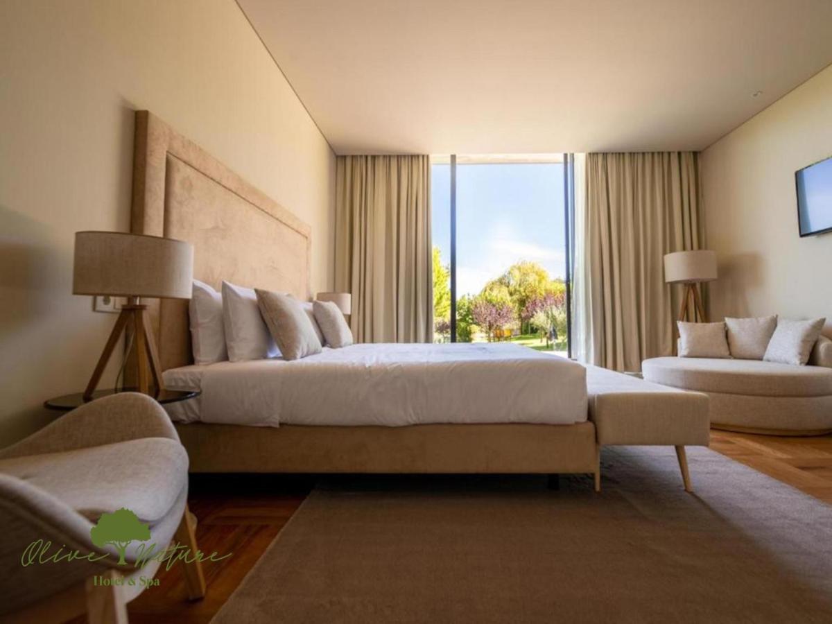 Uma cama ou camas num quarto em Olive Nature Hotel & SPA - Quinta Valle de Passos