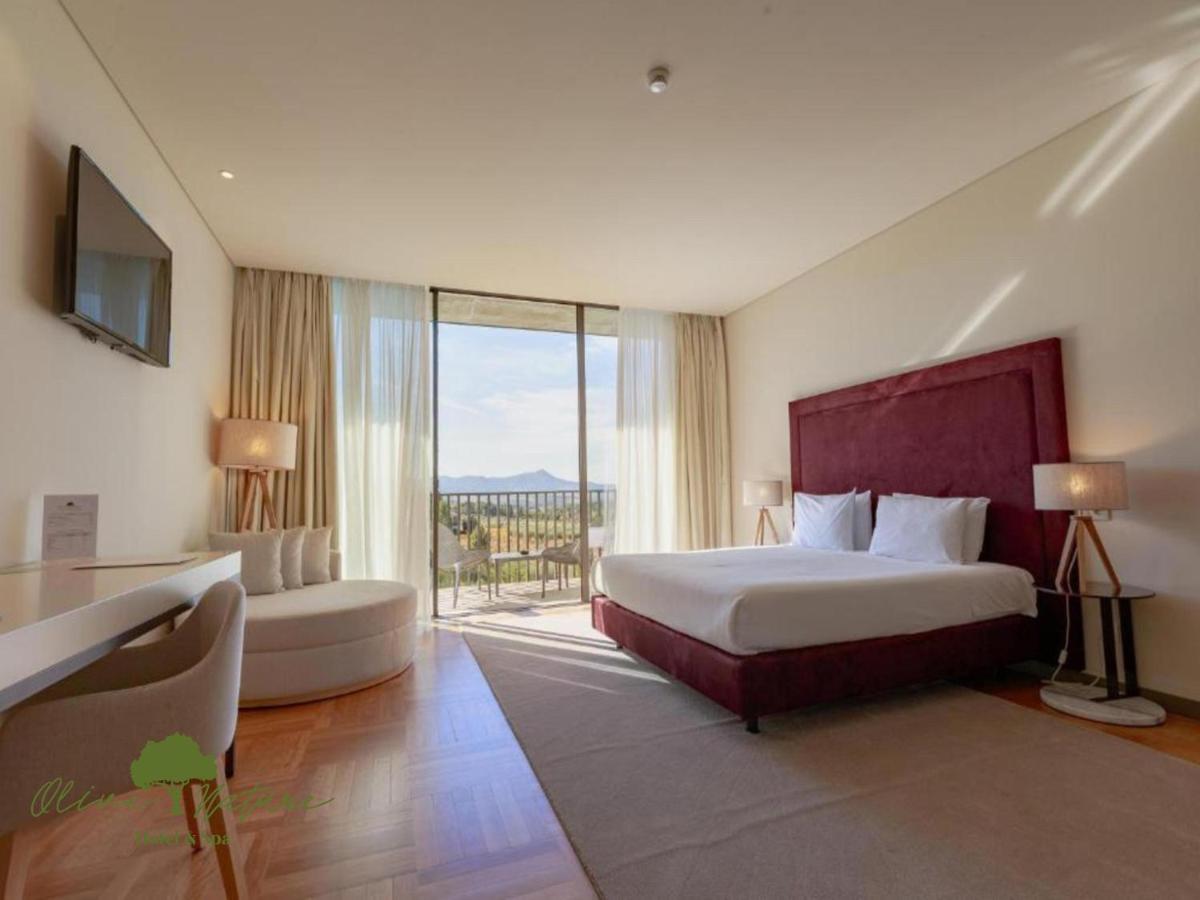 Uma cama ou camas num quarto em Olive Nature Hotel & SPA - Quinta Valle de Passos