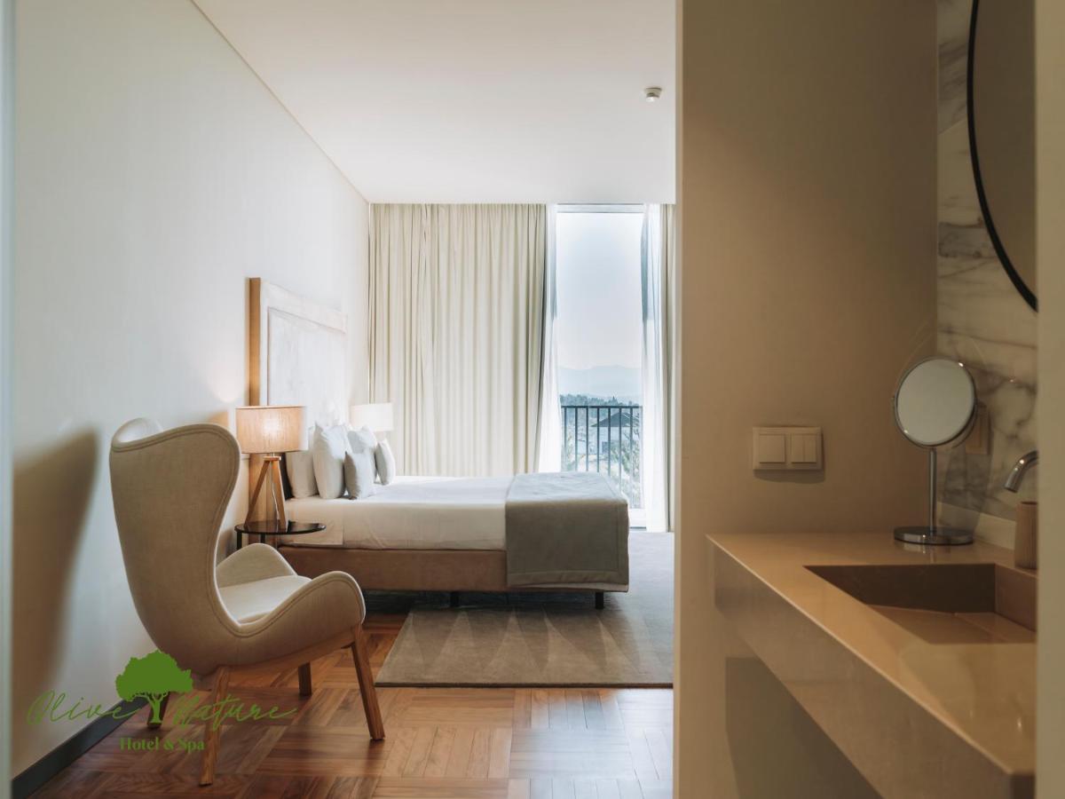 Uma cama ou camas num quarto em Olive Nature Hotel & SPA - Quinta Valle de Passos