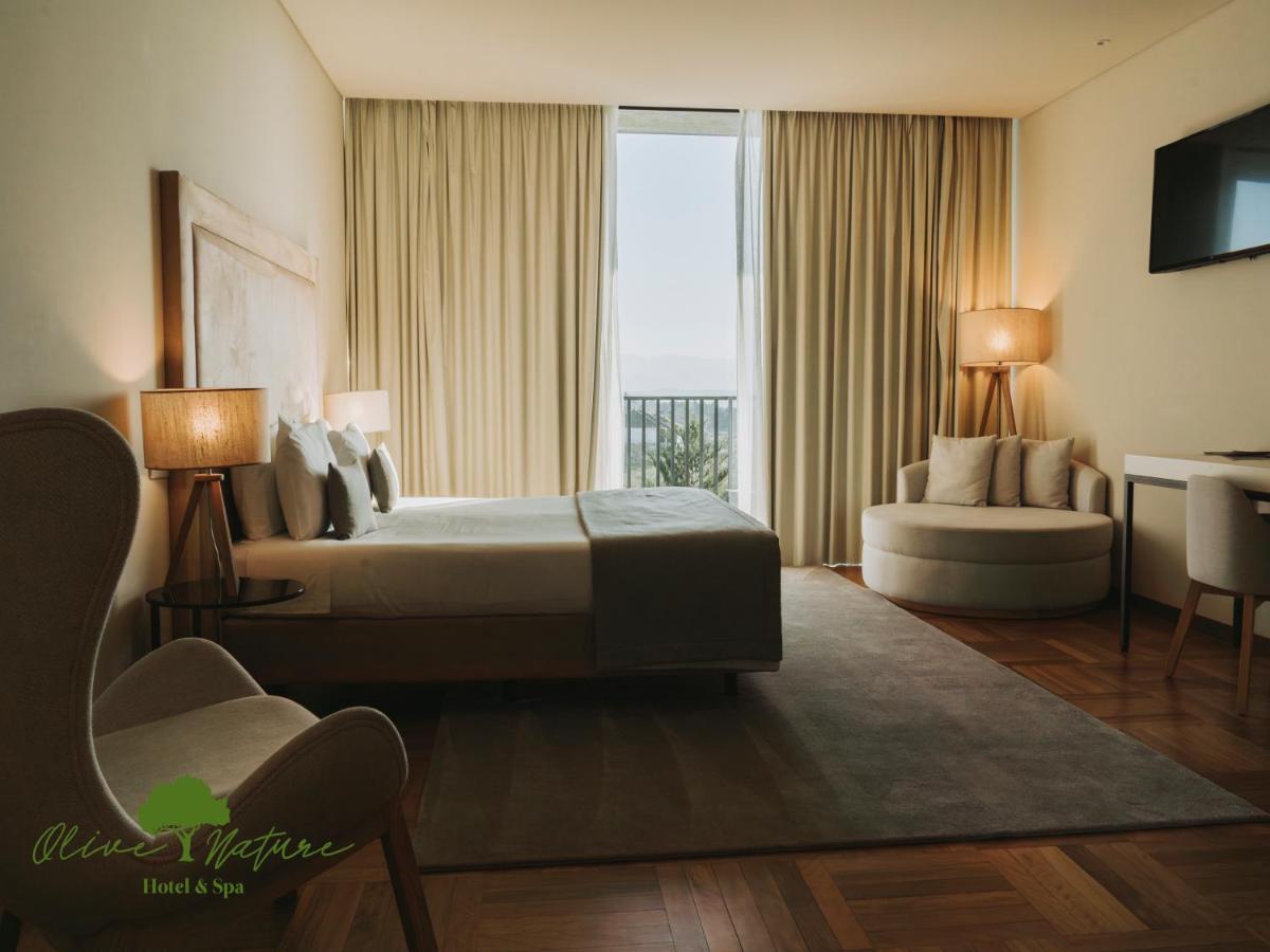 Uma cama ou camas num quarto em Olive Nature Hotel & SPA - Quinta Valle de Passos