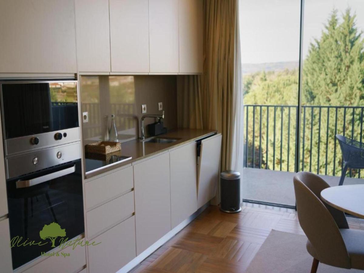 A cozinha ou kitchenette de Olive Nature Hotel & SPA - Quinta Valle de Passos