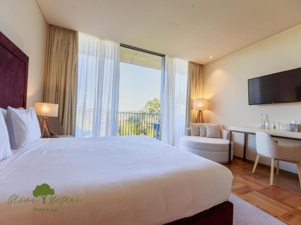 Uma cama ou camas num quarto em Olive Nature Hotel & SPA - Quinta Valle de Passos