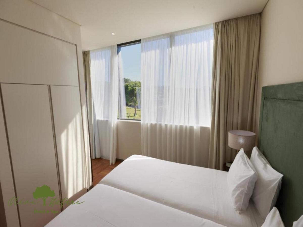 Uma cama ou camas num quarto em Olive Nature Hotel & SPA - Quinta Valle de Passos