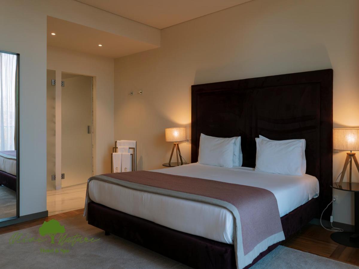 Uma cama ou camas num quarto em Olive Nature Hotel & SPA - Quinta Valle de Passos