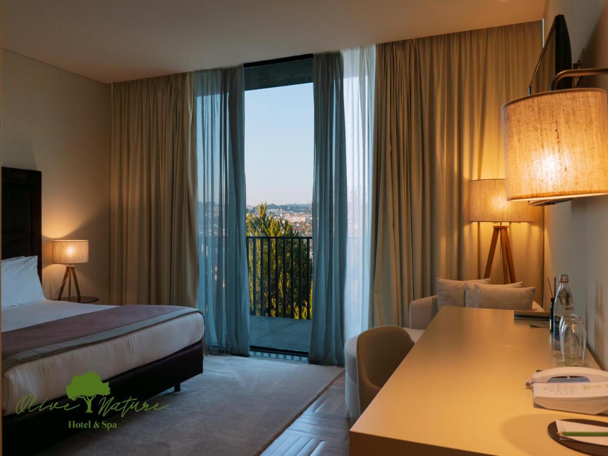 Uma cama ou camas num quarto em Olive Nature Hotel & SPA - Quinta Valle de Passos