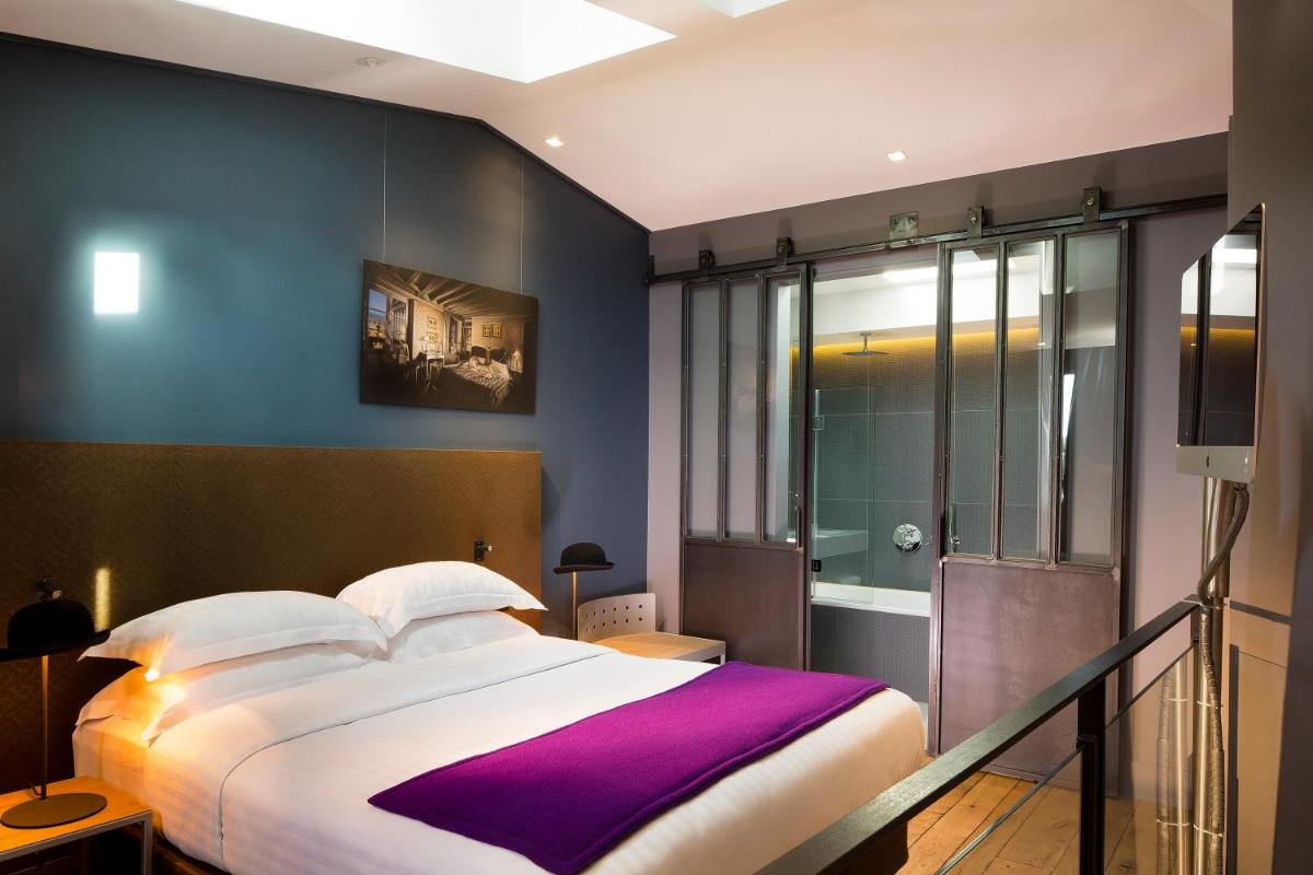 Un ou plusieurs lits dans un hébergement de l'établissement Hotel & Spa La Belle Juliette