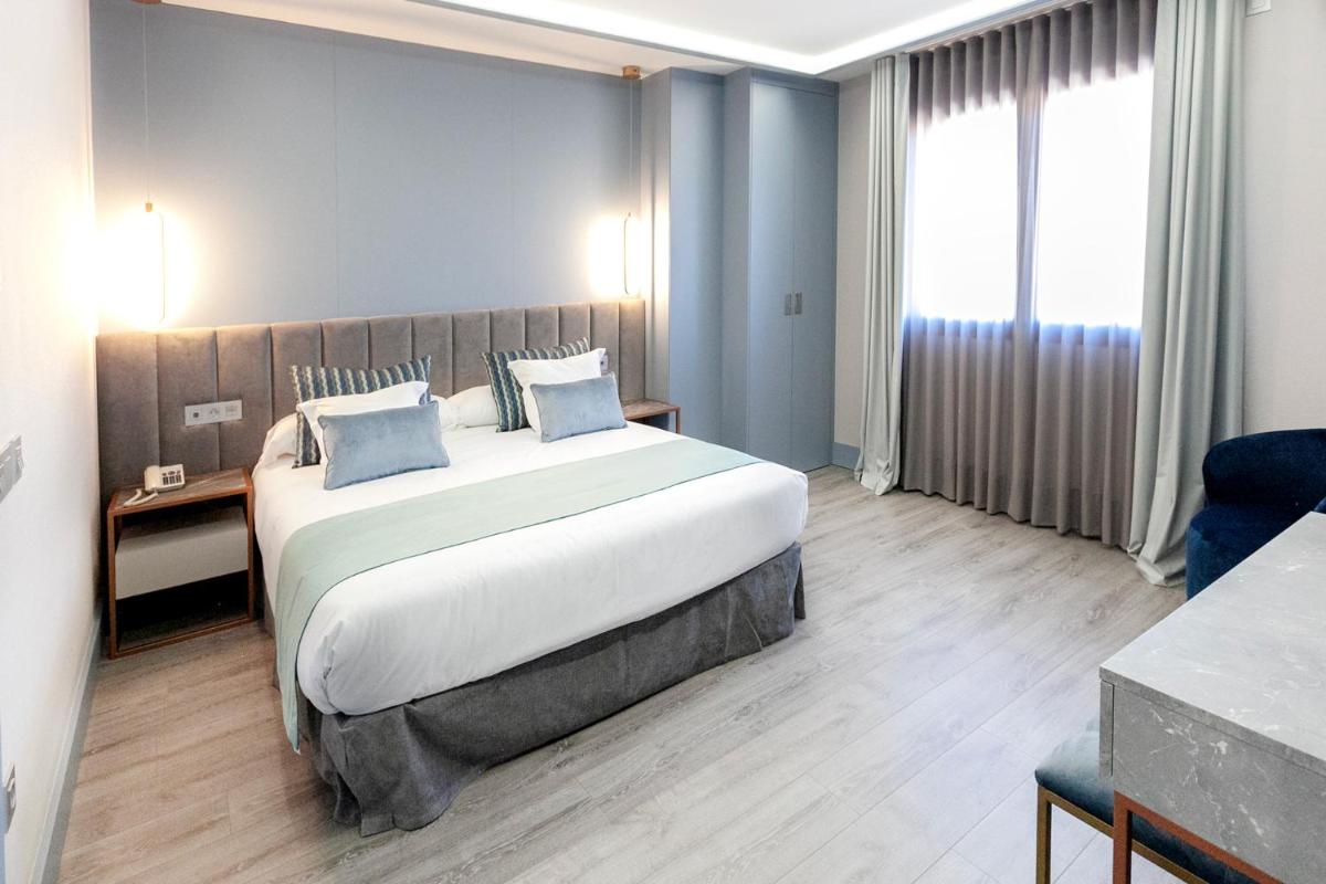 Cama o camas de una habitación en Hotel Alfonso VIII