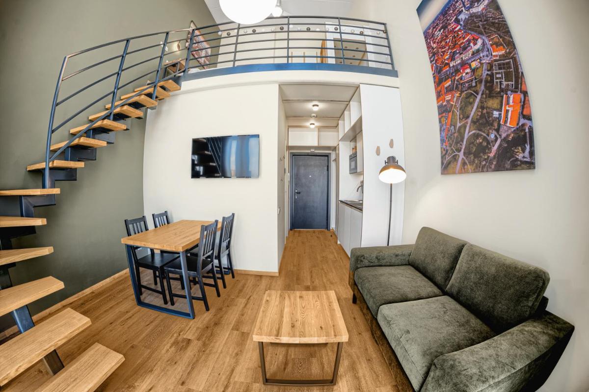 TopFloor Apartments - Housity