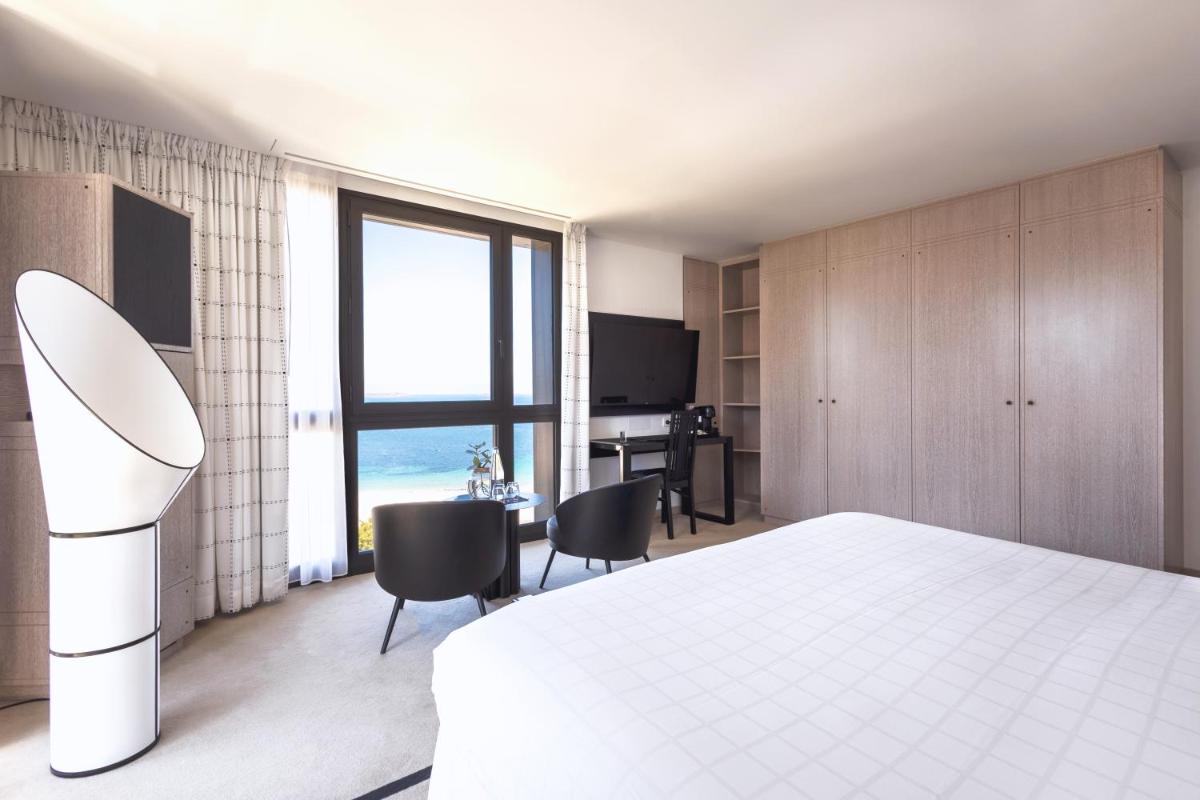 Un ou plusieurs lits dans un hébergement de l'établissement L'Agapa Hôtel - Spa Codage