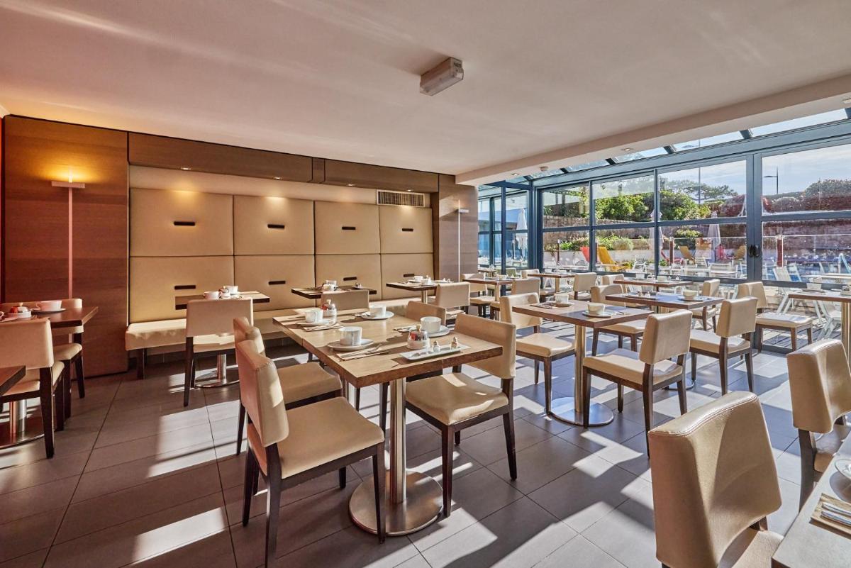 Restaurant ou autre lieu de restauration dans l'établissement Le Churchill Hôtel & Spa