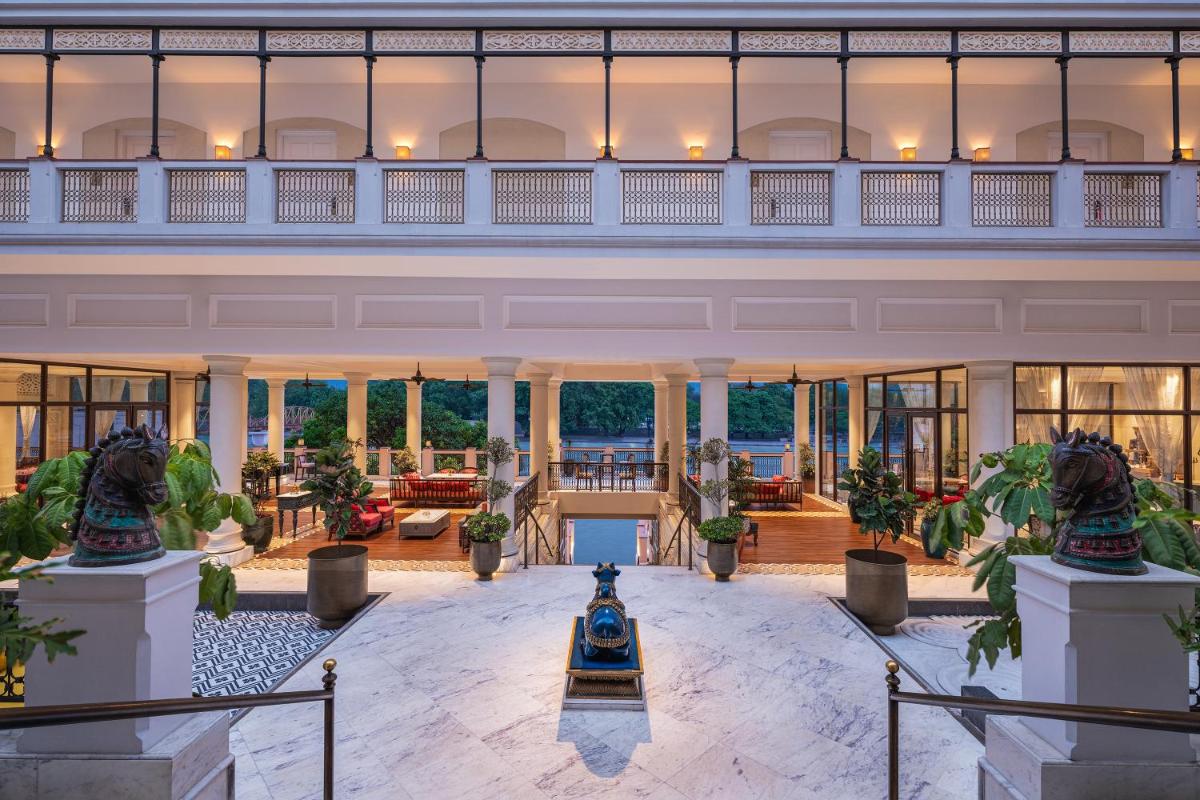 an indoor lobby of a building with a large building at Pilibhit House, Haridwar – IHCL SeleQtions in Haridwār