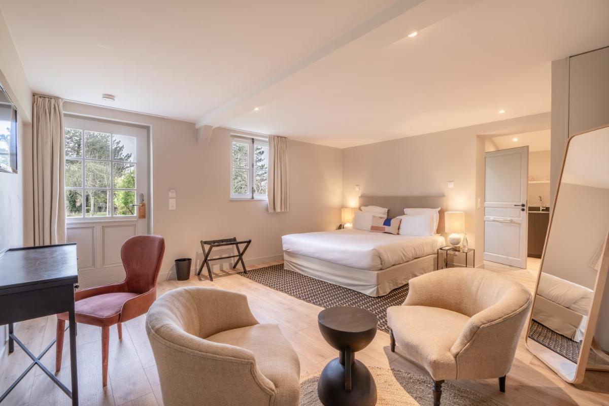 Un ou plusieurs lits dans un hébergement de l'établissement Les Manoirs des Portes de Deauville - Small Luxury Hotel Of The World