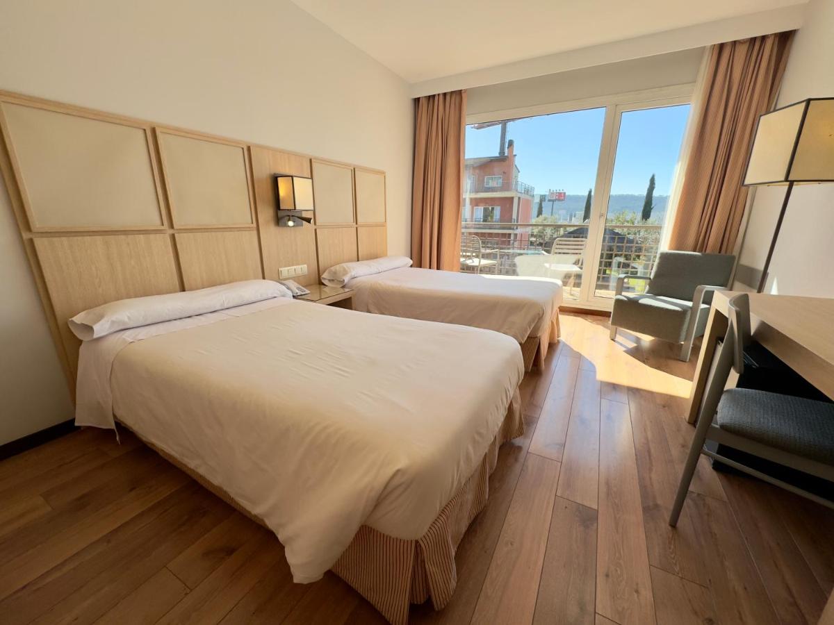 Cama o camas de una habitación en Hotel Isla de La Garena