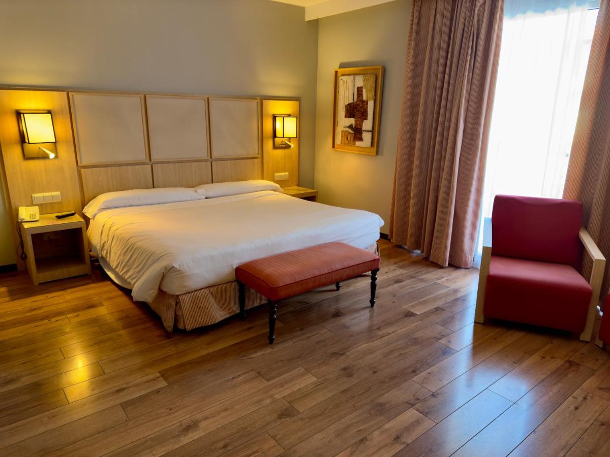 Cama o camas de una habitación en Hotel Isla de La Garena