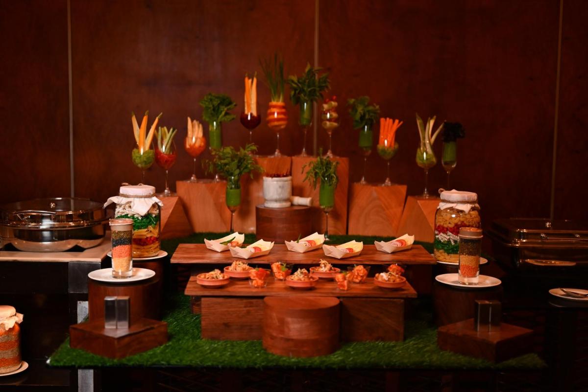 a display of food on a table in a kitchen at The Park Kolkata in Kolkata