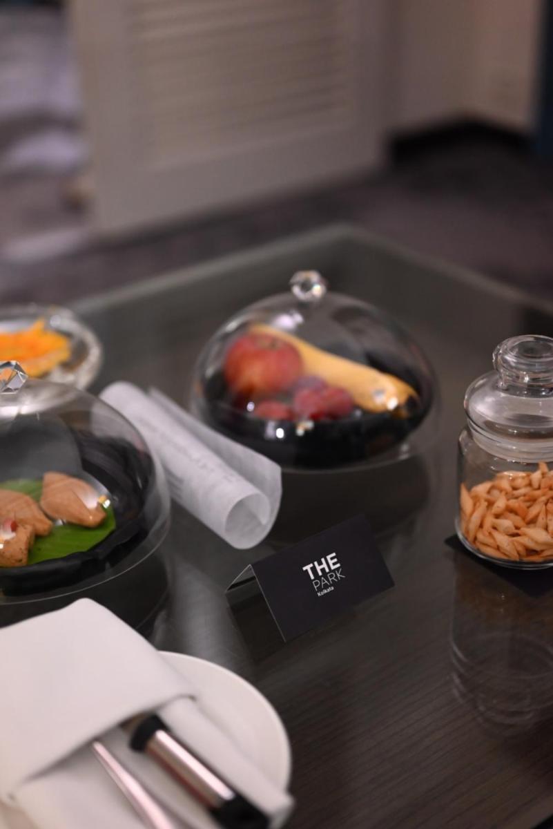 a buffet with bowls of food on a table at The Park Kolkata in Kolkata