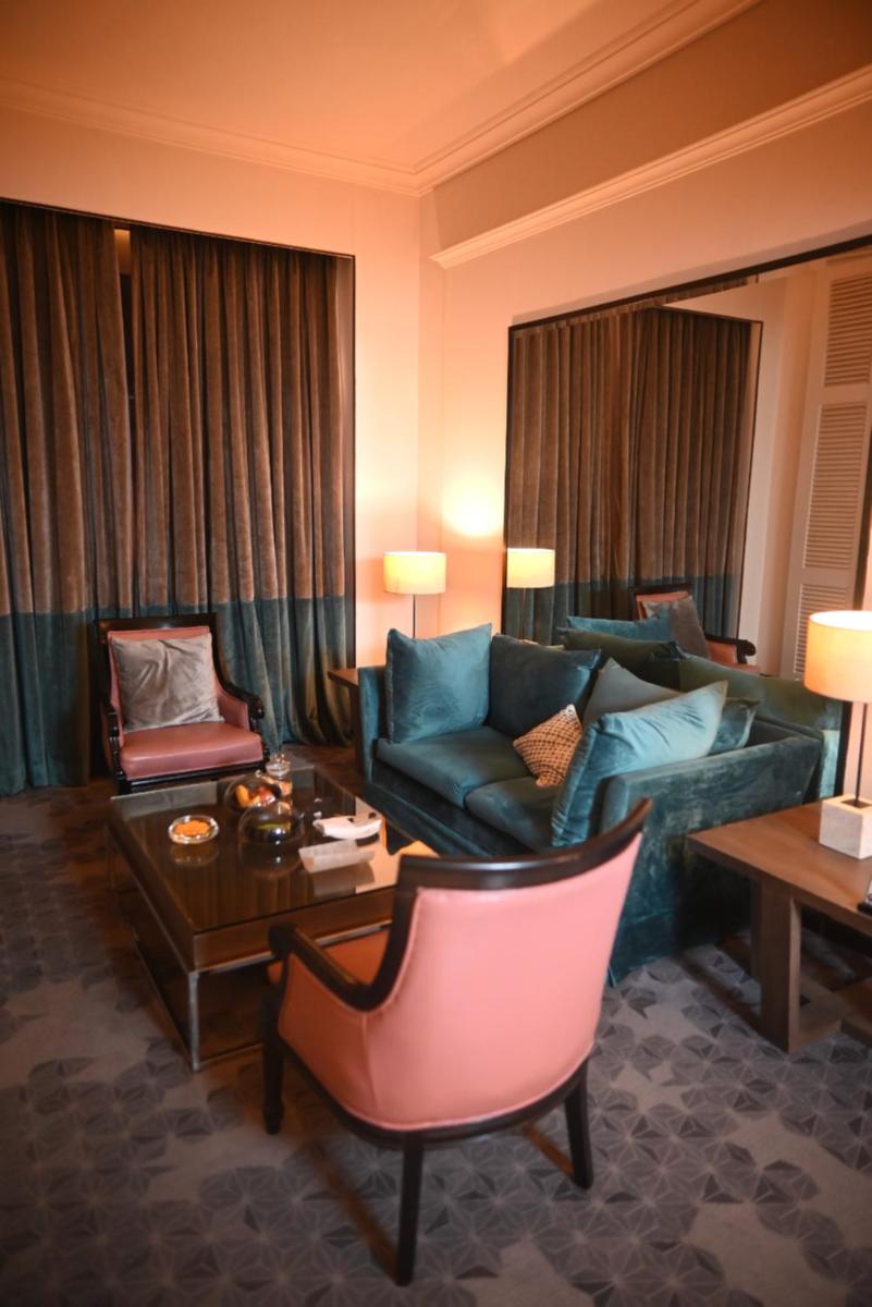 a living room with a couch and a table at The Park Kolkata in Kolkata