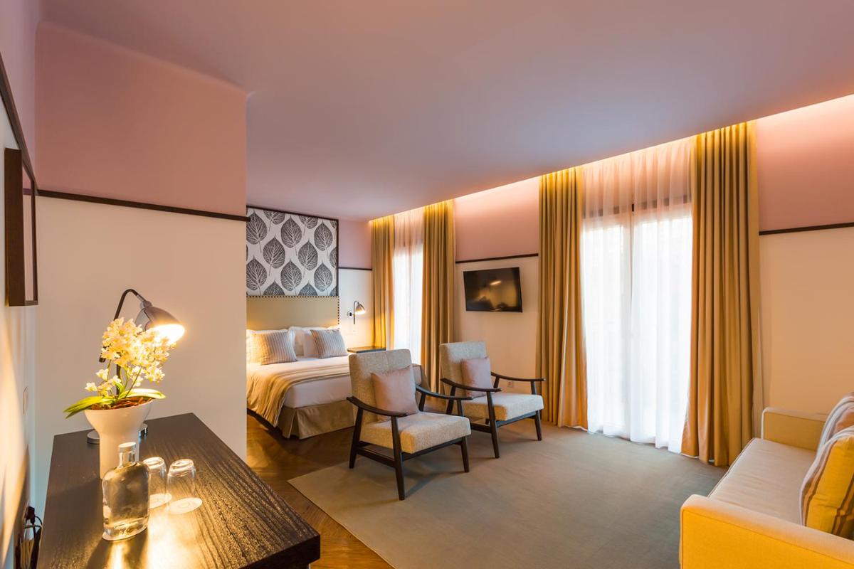 Uma área de estar em Castanheiro Boutique Hotel