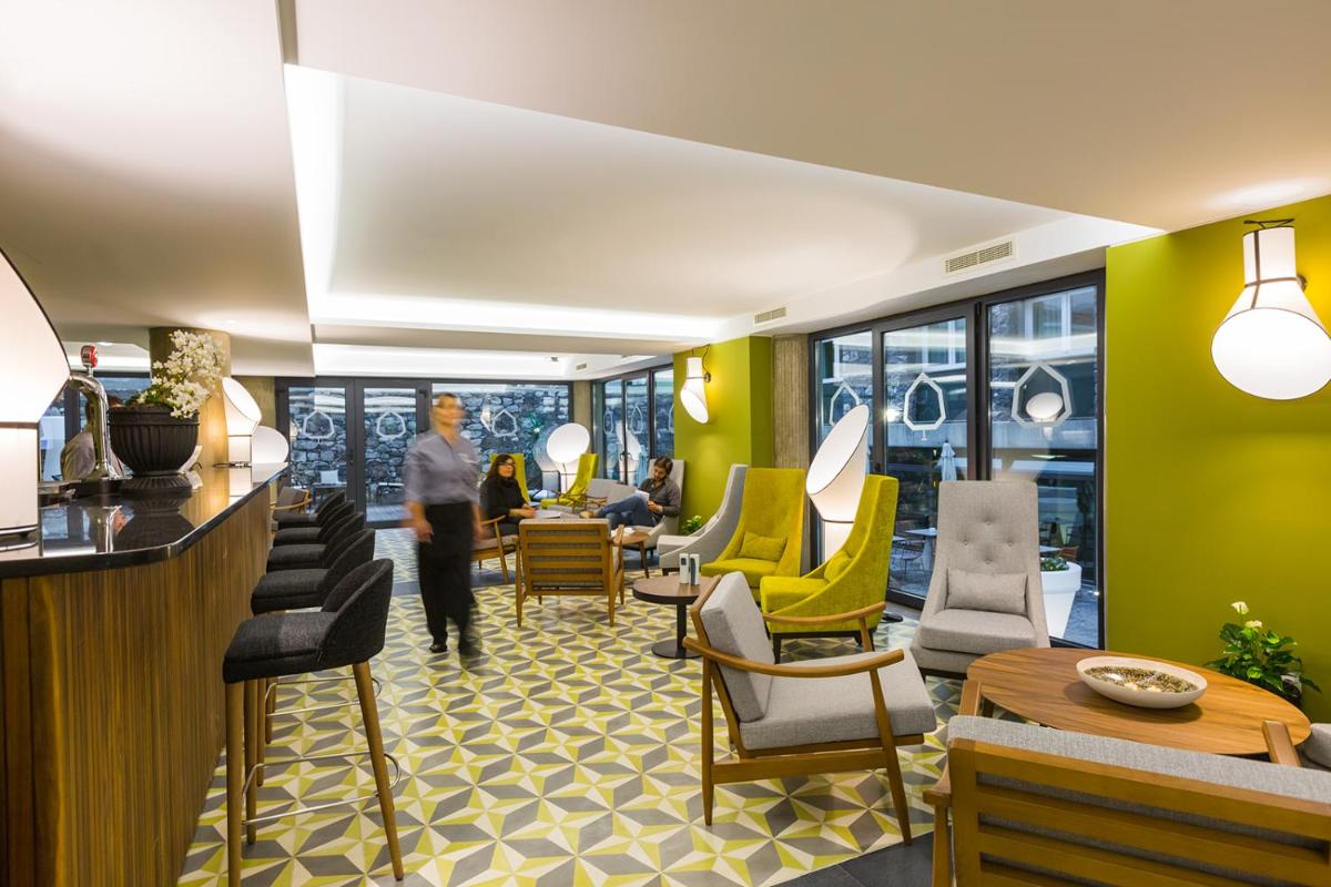 Uma área de estar em Castanheiro Boutique Hotel