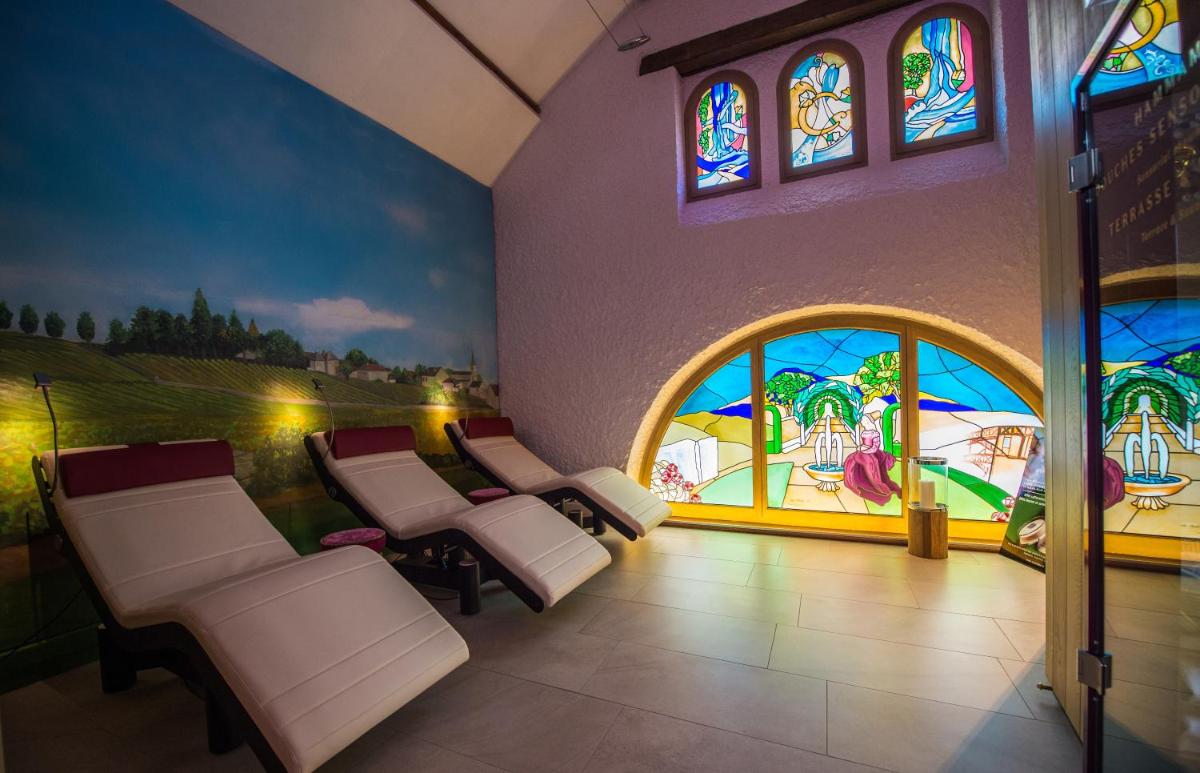 Coin salon dans l'établissement Hôtel Le Cep & Spa